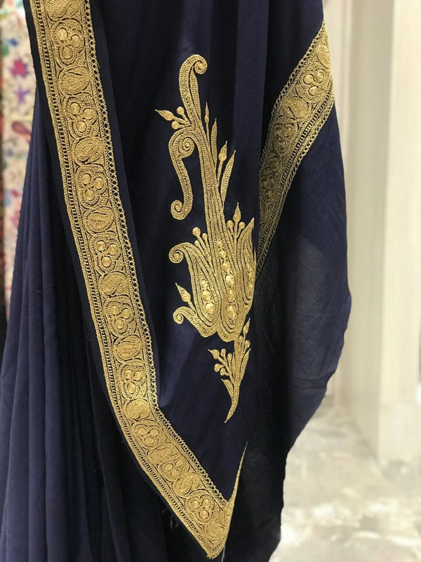 #NavyBlue fabric with gold embroidery on a blurred background