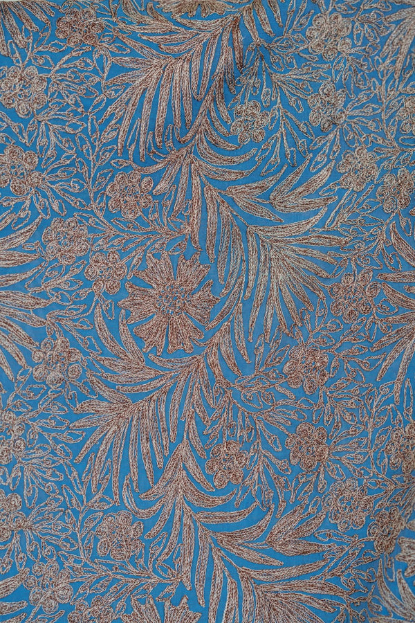 Floral patterned fabric with blue and bronze colors
#AquaBlue
