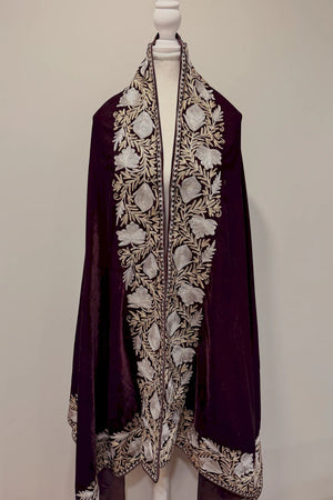 #Wine embroidered garment on a mannequin against a plain background