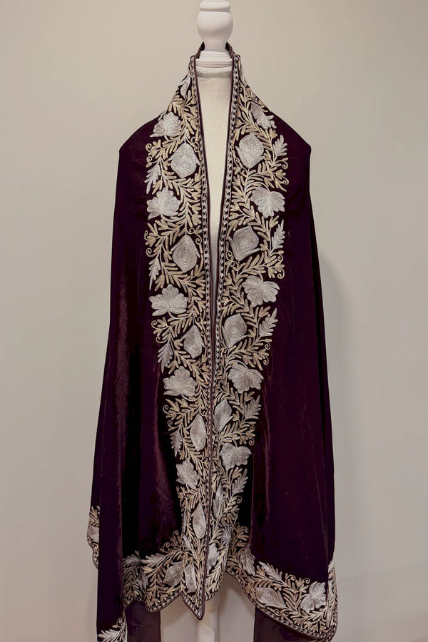 #Wine embroidered garment on a mannequin against a plain background