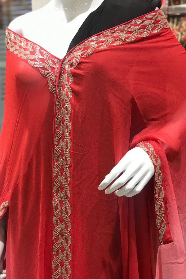 Red dress with gold embroidery on a mannequin
